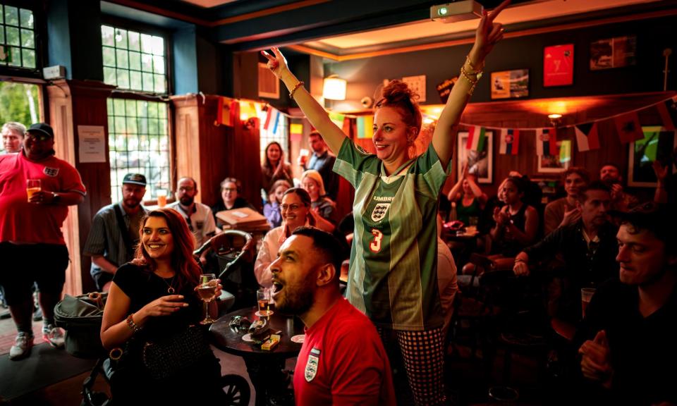 <span>Fans celebrate England's victory over Slovakia at the Euro 2024 championship on 30 June at a pub in London.</span><span>Photograph: AP</span>