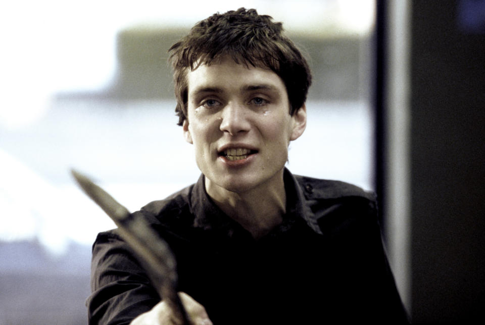 Close-up of Cillian holding a tool