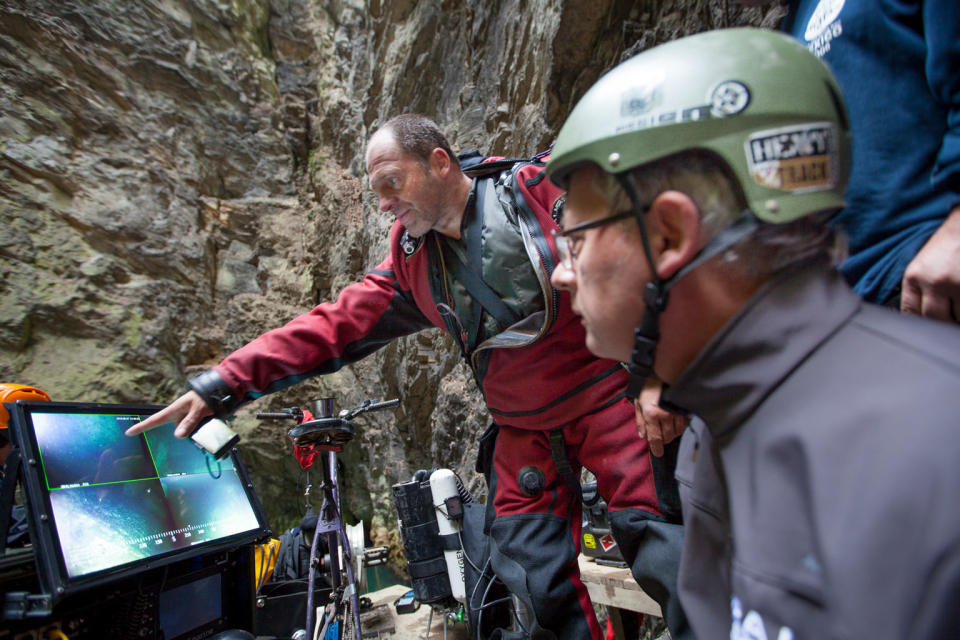 With the assistance of an ROV, the expedition team was able to measure the cave's depth and explore the bottom of the limestone abyss. <cite>Photograph by Marcin Jamkowski/National Geographic</cite>