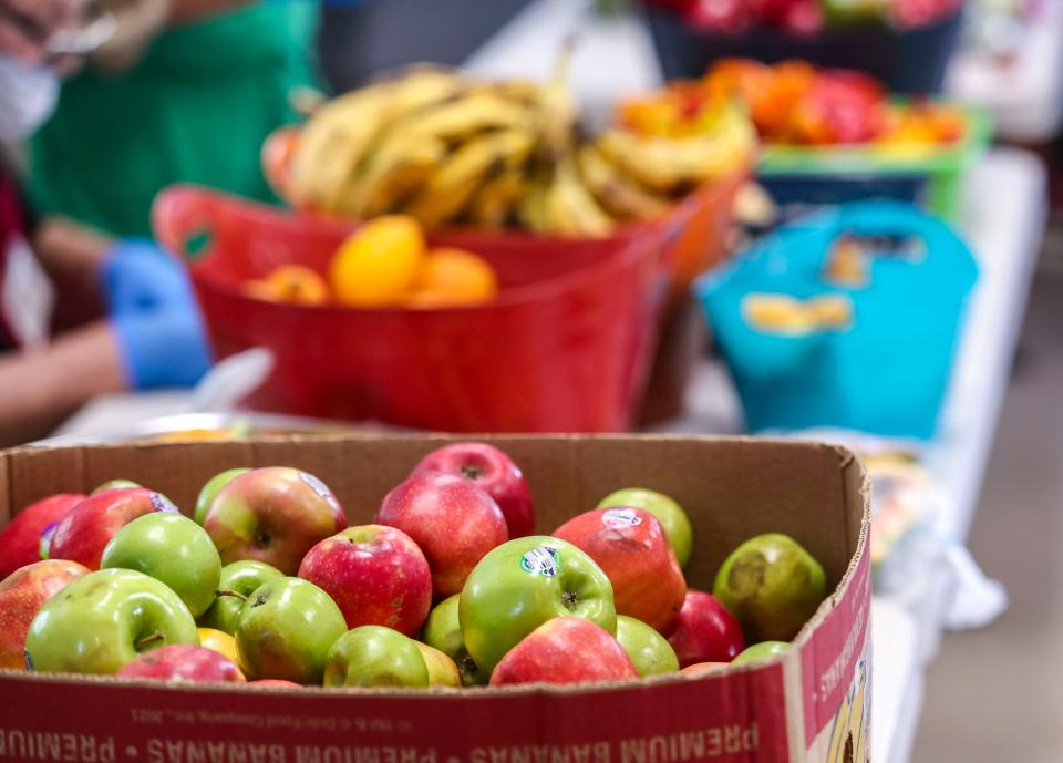 Apples and other fruits are seen available for clients at the Cathedral City Senior Center food bank in Cathedral City, Calif., Monday, April 25, 2022. 