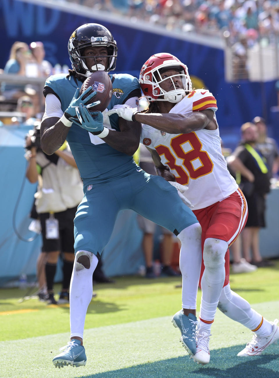 Kansas City Chiefs cornerback L'Jarius Sneed (38) breaks up a pass intended for Jacksonville Jaguars wide receiver Calvin Ridley (0) during the second half of an NFL football game, Sunday, Sept. 17, 2023, in Jacksonville, Fla. (AP Photo/Phelan M. Ebenhack)