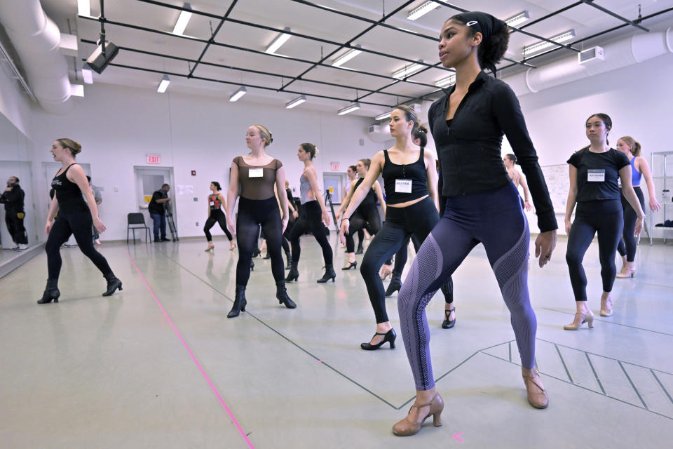 Boston Conservatory at Berklee student Rhapsody Stiggers, foreground, of St. Paul, Minn., takes part in a Rockettes Precision Dance Technique course led by Amarisa LeBar, left, Wednesday, Feb. 8, 2023, at the Boston Conservatory at Berklee in Boston. (AP Photo/Josh Reynolds)