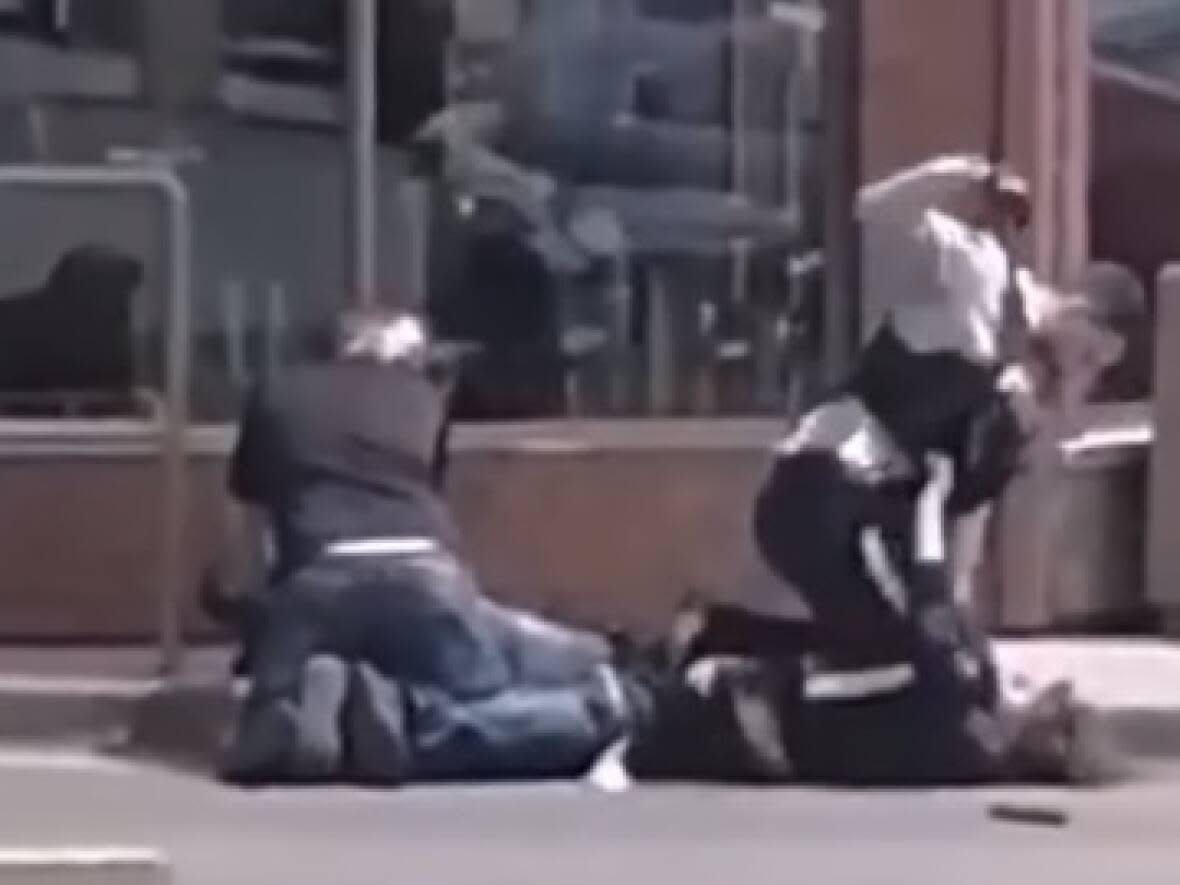 An RCMP officer was filmed repeatedly punching a man during an arrest in Campbellton on July 2. Const. Pierrick Caron is facing an assault charge as a result. (Facebook - image credit)