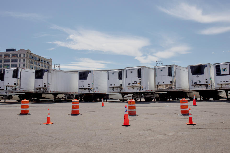 Refrigerated tractor trailers outside the Marine Terminal, generators roaring. | Natalie Keyssar for TIME