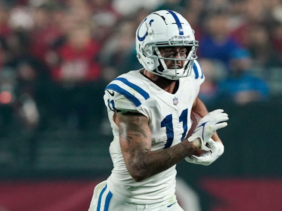 Micheal Pittman Jr. runs with the ball after a catch against the Arizona Cardinals.