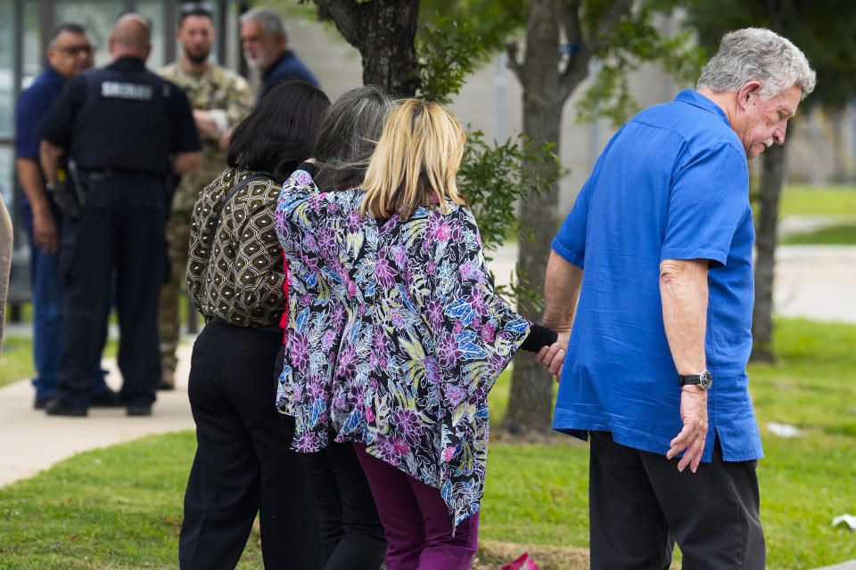 Family members of Harris County Deputy John Hampton Coddou leave the Harris County Institute of Forensic Sciences after Caddou's remains were escorted there Tuesday, April 23, 2024, in Houston. Coddou was struck by a vehicle while responding to a crash on Highway 99 and Cumberland Ridge Drive in Cypress, Texas. The deputy was transported by Life Flight in critical condition to Memorial Hermann where he later died. (Brett Coomer/Houston Chronicle via AP)