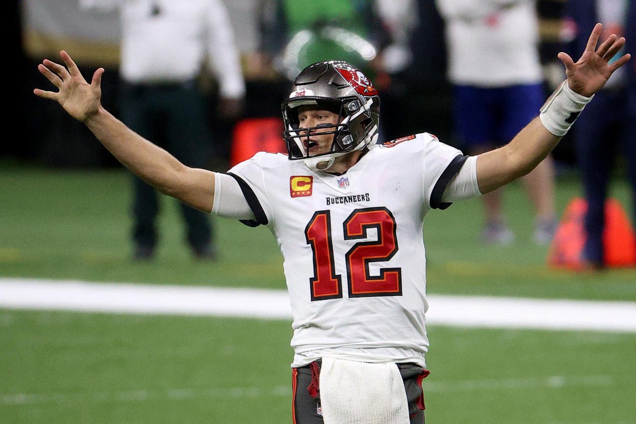 Tom Brady #12 of the Tampa Bay Buccaneers celebrates a first down against the New Orleans Saints late in the fourth quarter in the NFC Divisional Playoff game at Mercedes Benz Superdome on January 17, 2021 in New Orleans, Louisiana. (Photo by Chris Graythen/Getty Images)