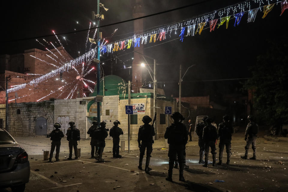 Fireworks are released towards Israeli soldiers during clashes amid a night-time curfew in Lod on May 12.<span class="copyright">Oren Ziv—picture alliance/Getty Images</span>