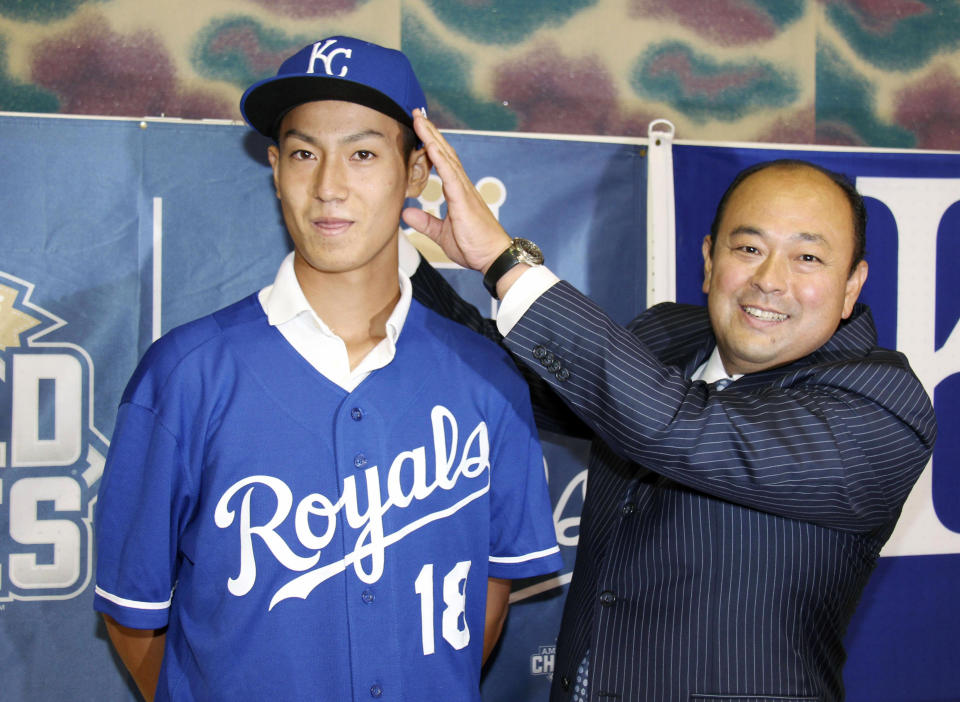 Newly-signed Kaito Yuki with Royals scout <span>Hiroyuki Oya.</span> (Associated Press)