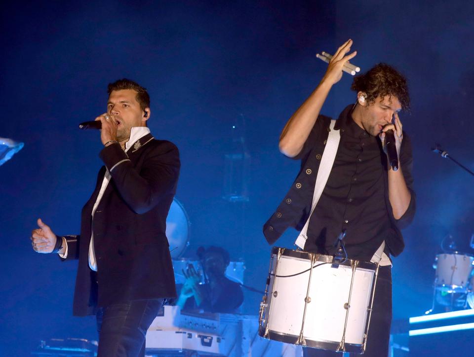 For King + Country band members Joel Smallbone and Luke Smallbone, a Christian pop duo, performs at the Iowa State Fair on Thursday night.