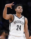 Brooklyn Nets guard Cam Thomas (24) celebrates after scoring in the final seconds of the second half of an NBA basketball game against the New York Knicks, Wednesday, Feb. 16, 2022, in New York. (AP Photo/John Minchillo)
