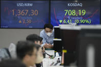 Currency traders work at the foreign exchange dealing room of the KEB Hana Bank headquarters in Seoul, South Korea, Thursday, Nov. 10, 2022. Asian stock markets followed Wall Street lower on Thursday ahead of a U.S. inflation update that will likely influence Federal Reserve plans for more interest rate hikes after elections left control of Congress uncertain.(AP Photo/Ahn Young-joon)