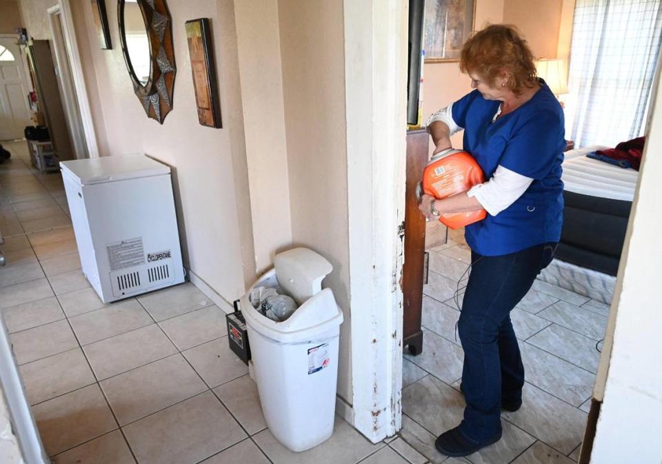 In-Home Support Services (IHSS) care worker Wendy Davenport helps helps with the laundry for her client Jovonna Martinez Wednesday, March 15, 2023 in Fresno. Davenport and other SEIU workers are looking for a salary increase from $16/hour to $20/hour for the work they do.