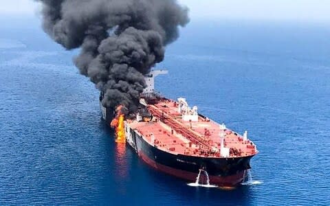 An oil tanker is seen after it was attacked at the Gulf of Oman - Credit: Reuters