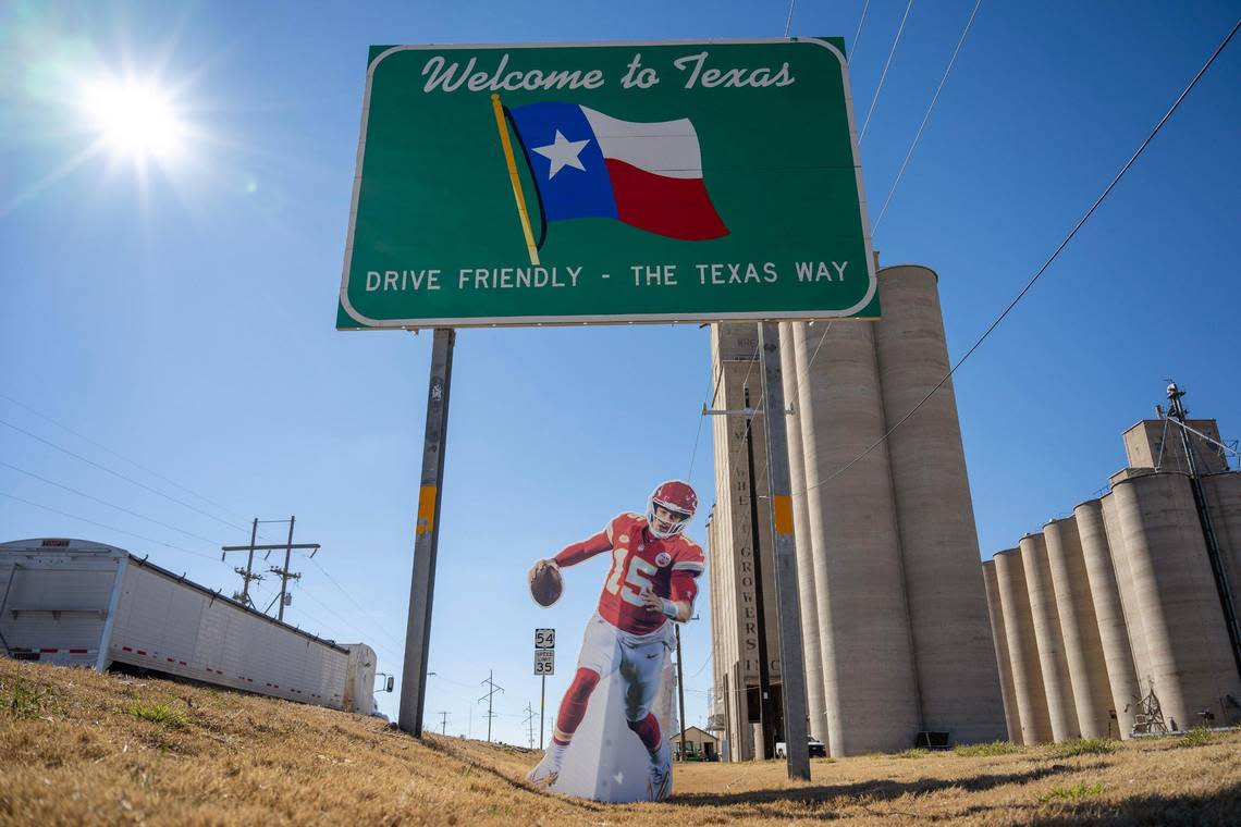 A life-size cutout featuring Kansas City Chiefs quarterback Patrick Mahomes stands next to a Texas welcome sign on Monday, Feb. 5, 2024, in Goodwell, Texas.