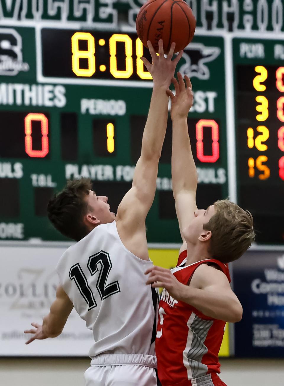 Smithville's Carter Piatt wins the opening tip against Norwayne's Justin Rupp.