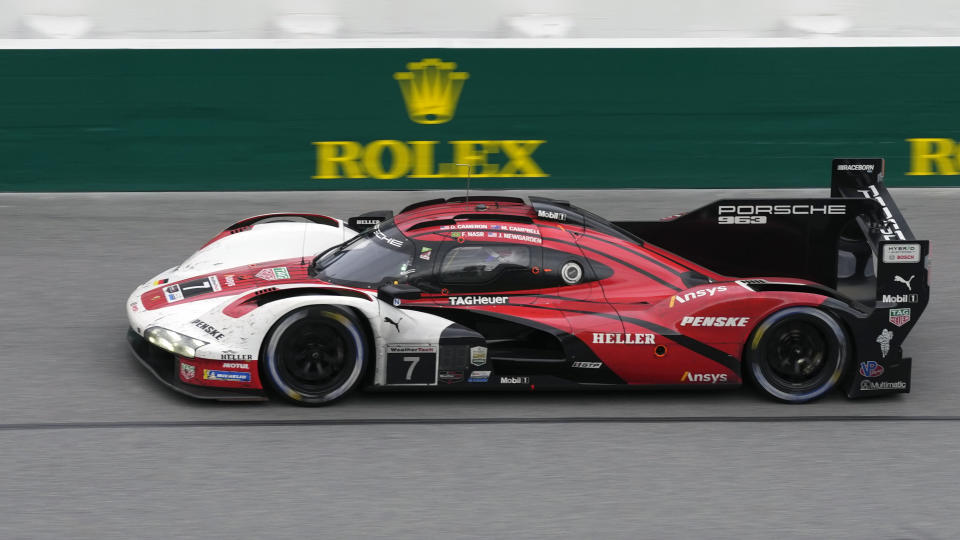 Matt Campbell, of Australia, driving a Porsche 963 holds the lead position during the final hours of the Rolex 24 hour auto race at Daytona International Speedway, Sunday, Jan. 28, 2024, in Daytona Beach, Fla. (AP Photo/John Raoux)