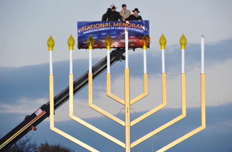 Rabbi Levi Shemtov, Washington Director, American Friends of Lubavitch; White Houe Budget Director Jacob Lew and Rabbi Abraham Shemtov, Director, American Friends of Lubavitch, take part in the annual national Hanukkah menorah lighting ceremony at the White House Ellipse December 01, 2010 (AFP via Getty Images)