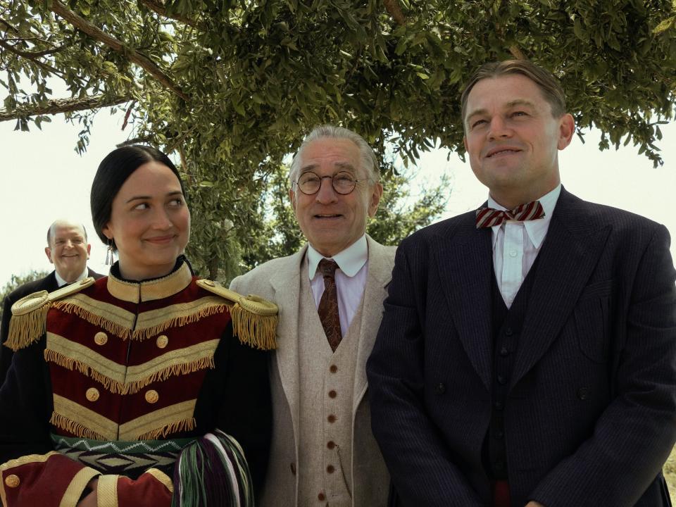 Lily Gladstone, Robert De Niro and Leonardo DiCaprio in "Killers of the Flower Moon."