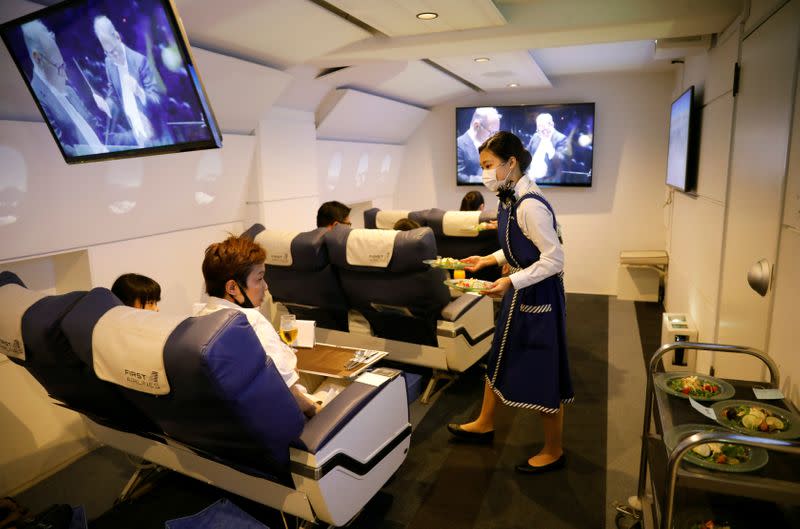 Customers take VR flight experiences at First Airlines in Tokyo