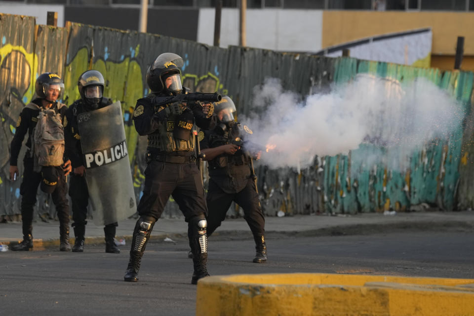 Police launch tear gas to disperse demonstrators during one of the daily protests demanding the resignation of Peruvian President Dina Boluarte, in Lima, Peru, Thursday, Jan. 26, 2023. Protesters are seeking immediate elections, President Dina Boluarte's resignation, the release of President Pedro Castillo, ousted and arrested for trying to dissolve Congress in December, and justice for protesters killed in clashes with police. (AP Photo/Martin Mejia)