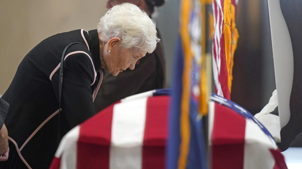 Elaine Hatch stands at the casket of husband, former U.S. Sen. Orrin Hatch, while he lies in state at the Utah Capitol Wednesday, May 4, 2022, in Salt Lake City. Hatch, the longest-serving Republican senator in history and a fixture in Utah politics for more than four decades, died last month at the age of 88. (AP Photo/Rick Bowmer)