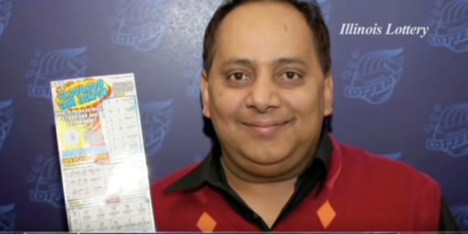 Urooj Khan posing with his winning lottery ticket.