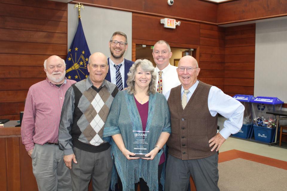Morgan County employee Deb Verley poses for a photo with her award for being named Outstanding Supportive County Executive Assistant of the Year by the Indiana Association of County Commissioners. Joining Verly in the photo is Morgan County Auditor Dan Bastin, right, county commissioner Kenny Hale, county administrator Josh Messmer, county commissioner Bryan Collier and county commissioner Don Adams.