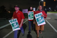 United Auto Workers members picket outside the General Motors Detroit-Hamtramck assembly plant in Hamtramck, Mich., early Monday, Sept. 16, 2019. Roughly 49,000 workers at General Motors plants in the U.S. planned to strike just before midnight Sunday, but talks between the UAW and the automaker will resume. (AP Photo/Paul Sancya)