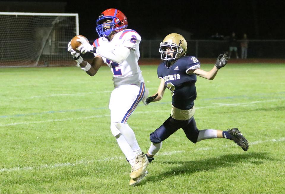 Hartford's Evan Lynds hauls in a long pass in the final minute of the Hurricanes 30-21 win over Essex on Friday night at EHS.