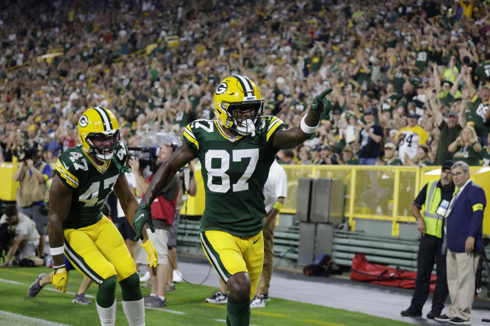 Green Bay Packers wide receiver Romeo Doubs (87) celebrates his touchdown reception with tight end Alize Mack (47) during the first half of a preseason NFL football game against the New Orleans Saints Friday, Aug. 19, 2022, in Green Bay, Wis. (AP Photo/Matt Ludtke)