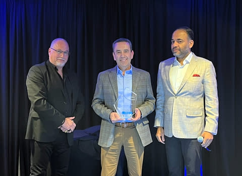 John Chaves, Senior Director, Engineering at Stratus Technologies, accepts the inaugural Joseph C. Belden Innovation Award. From left: Lane Cooper, Editorial Director, BizTech Reports; Chaves; and Dr. Ashish Chand, CEO and President, Belden. (Photo: Business Wire)