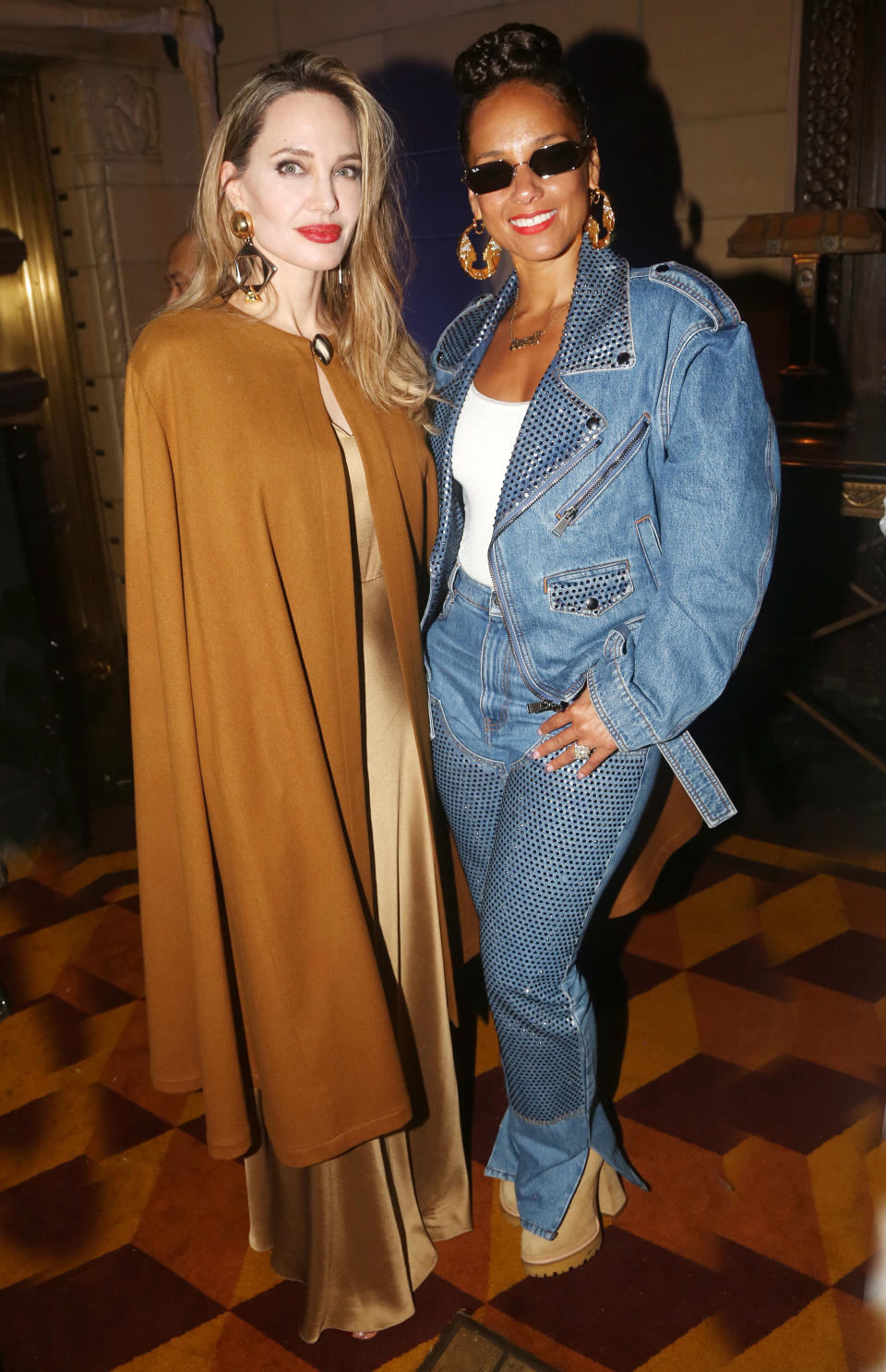 Angelina Jolie and Alicia Keys pose at the opening night after party for "The Outsiders"