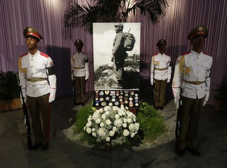 A photograph of Cuba's late President Fidel Castro stands in tribute to him inside the Jose Marti Memorial in Revolution Square in Havana, Cuba, November 28, 2016. REUTERS/Enrique De La Osa