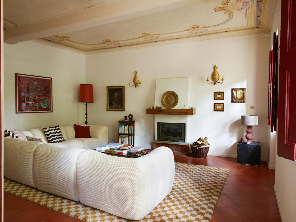 old Italian living room with modern white sofa