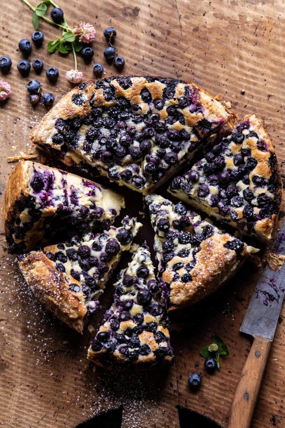 A sliced blueberry Basque cheesecake