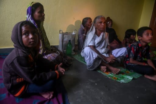 Villagers in Bakkhali, India take shelter inside a relief centre as Cyclone Bulbul approached