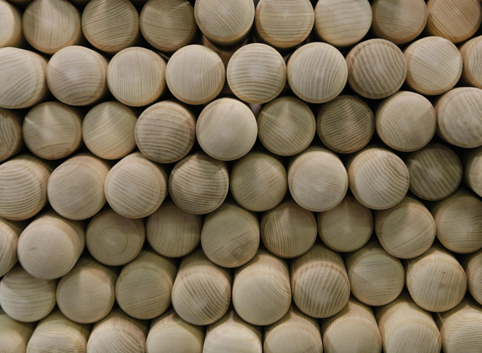 FILE - In this Feb. 19, 2010, file photo a stack of baseball bats wait in the Louisville Slugger Museum & Factory in Louisville, Ky. There are many destinations of interest to baseball fans around the country outside ballparks from museums and statues to historic homes. (AP Photo/Ed Reinke, File)