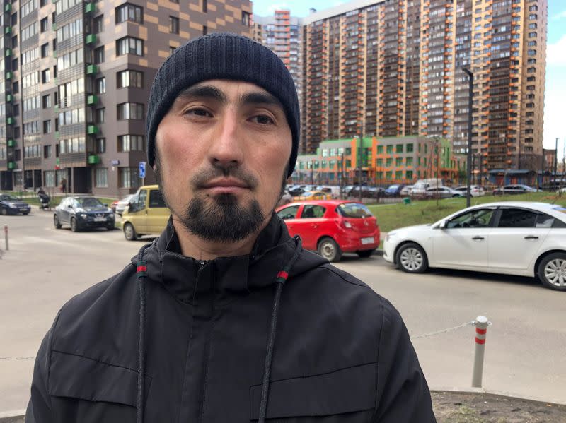 Ibragim Artykov, builder from Tajikistan, poses for a picture during an interview in Moscow