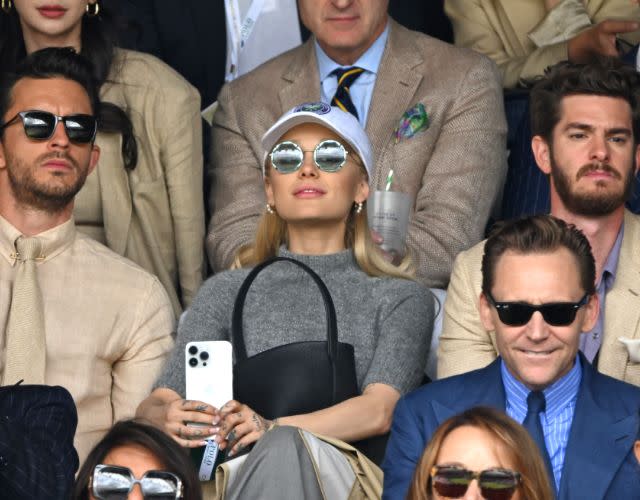 LONDON, ENGLAND – JULY 16: Jonathan Bailey, Ariana Grande, Tom Hiddleston and Andrew Garfield watch Carlos Alcaraz vs Novak Djokovic in the Wimbledon 2023 men’s final on Centre Court during day fourteen of the Wimbledon Tennis Championships at the All England Lawn Tennis and Croquet Club on July 16, 2023 in London, England. (Photo by Karwai Tang/WireImage)