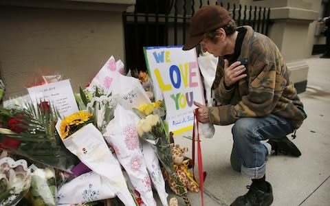  Flowers are laid in front of the Krim family's Upper West Side apartment - Credit: Getty/ Spencer Platt