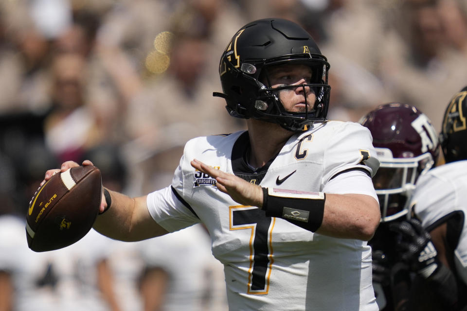 Appalachian State quarterback Chase Brice (7) looks to pass down field against Texas A&M during the first quarter of an NCAA college football game Saturday, Sept. 10, 2022, in College Station, Texas. (AP Photo/Sam Craft)