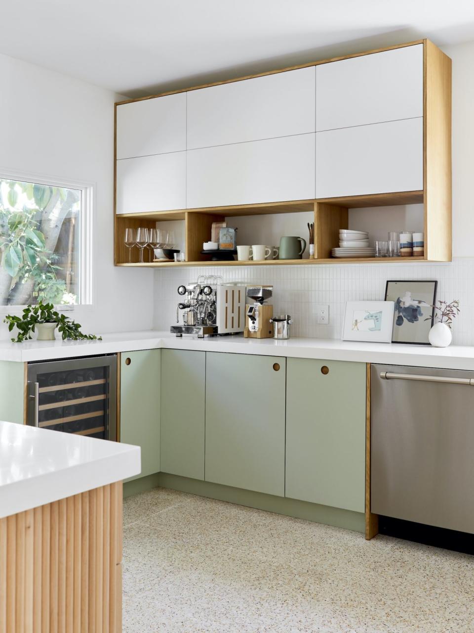 Clean design kitchen with green lower cabinets and white uppers