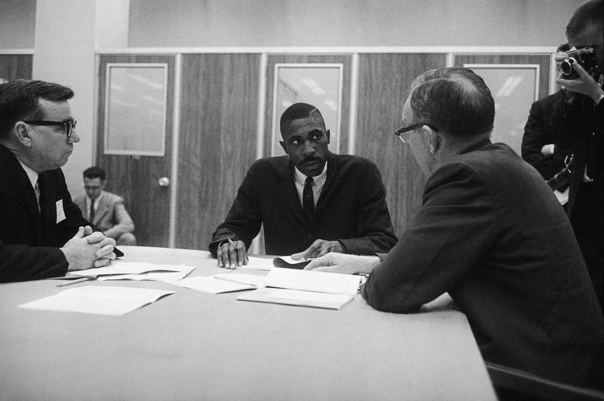 Harold A. Franklin begins the registration process to become the first Black student at Auburn University, Auburn, Ala., Jan. 4, 1964. At right is Dean W.V. Parker of the graduate school. 