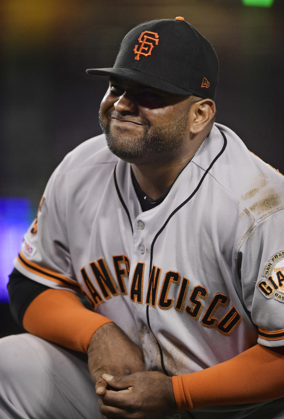 San Francisco Giants third baseman Pablo Sandoval winces after having his hand stepped on while forcing out Los Angeles Dodgers' Max Muncy during the fifth inning of a baseball game, Monday, June 17, 2019, in Los Angeles. (AP Photo/Mark J. Terrill)