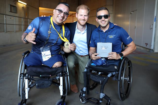 <p>Chris Jackson/Getty Images</p> Prince Harry, Duke of Sussex meets competitors as he attends the track and field events at the Invictus Games in Dusseldorf, Germany on Sept. 11.