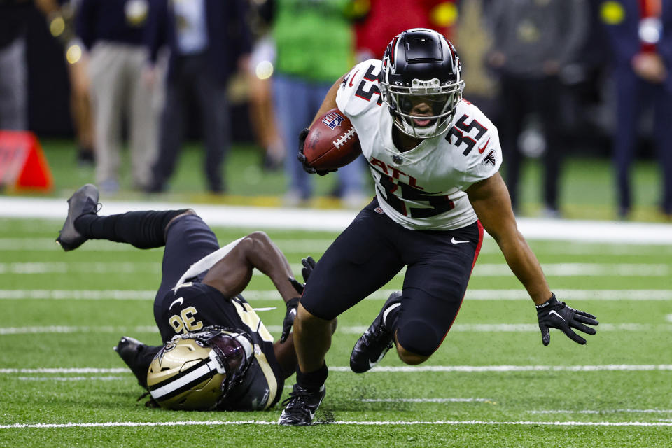 FILE - Atlanta Falcons' Avery Williams (35) breaks away from New Orleans Saints cornerback Isaac Yiadom (36) in the second half of an NFL football game in New Orleans, Sunday, Dec. 18, 2022. Falcons running back and return specialist Avery Williams is expected to miss the 2023 season after suffering a knee injury in a non-contact drill. Falcons coach Arthur Smith said Wednesday, June 7, 2023, Williams is expected to have season-ending surgery on Thursday to repair a torn anterior cruciate ligament. (AP Photo/Butch Dill, File)