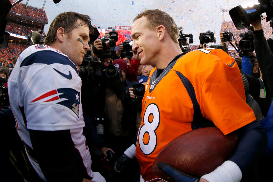 Peyton Manning of the Denver Broncos and Tom Brady of the New England Patriots speak after the AFC championship game on Jan. 24, 2016. (Ezra Shaw/Getty Images)