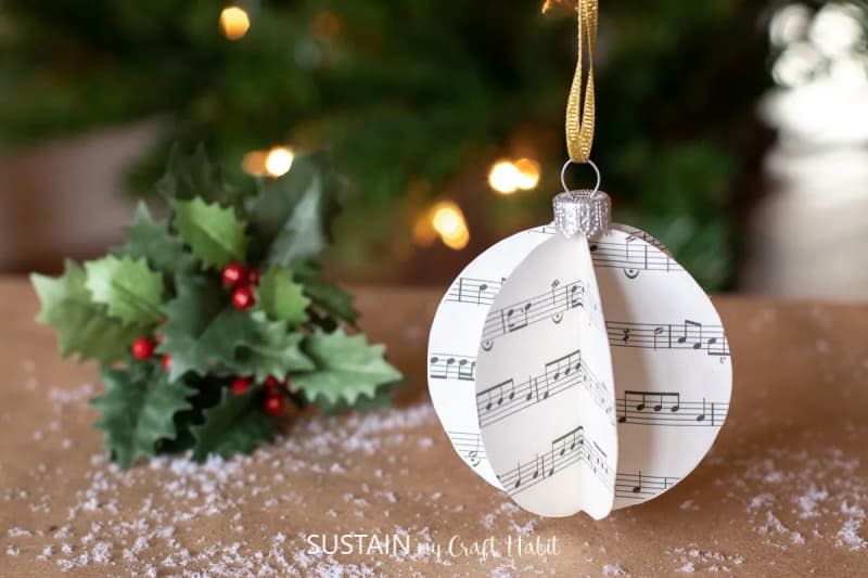 Three-dimensional round ornament made from pages of sheet music