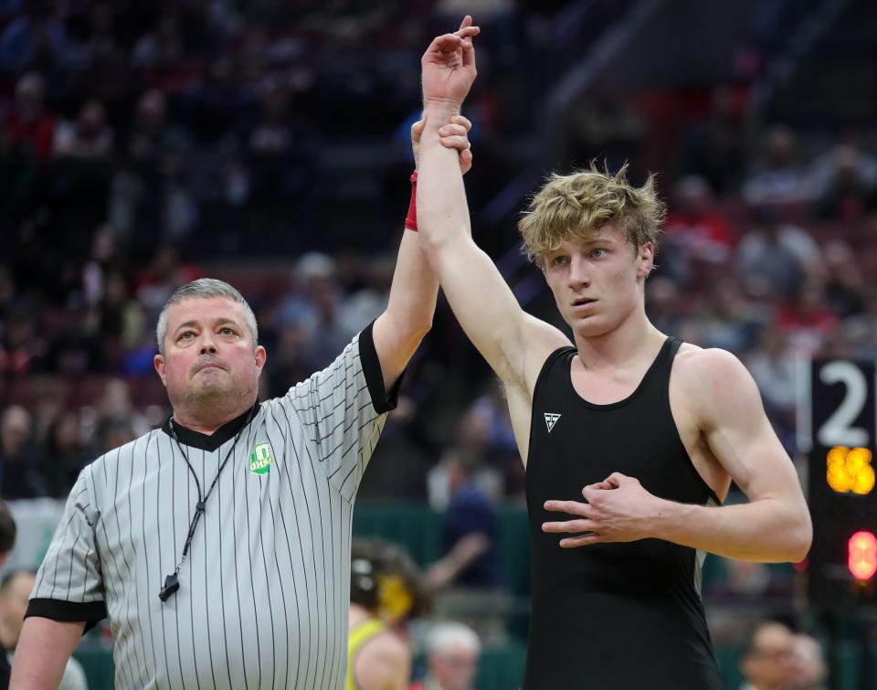 Jaxon Joy makes the No. 3 symbol after he became Wadsworth's second three-time state champion with a win over Cincinnati Moeller's Londen Murphy in Division I at 150 pounds.